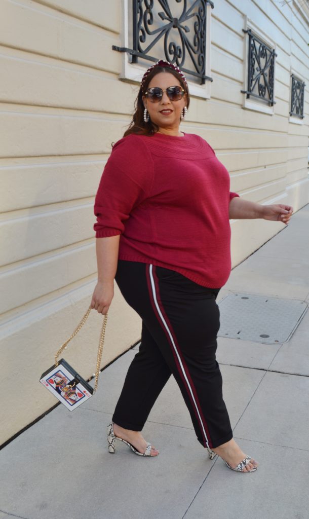 Tampa fashion blogger Farrah Estrella wearing a plus size sweater and a plus size side stripe trouser