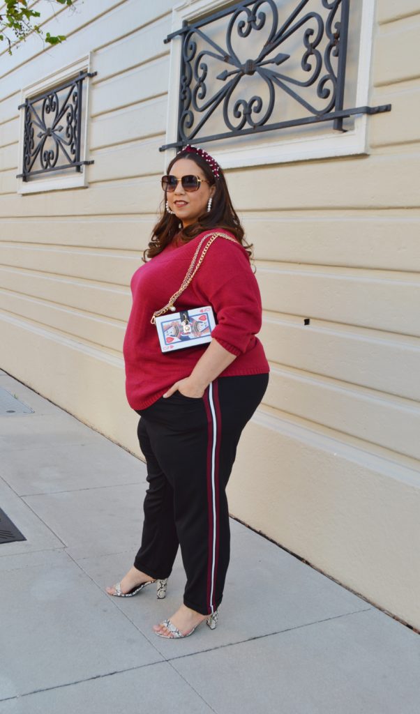 Tampa fashion blogger Farrah Estrella wearing a sweater and a side stripe trouser