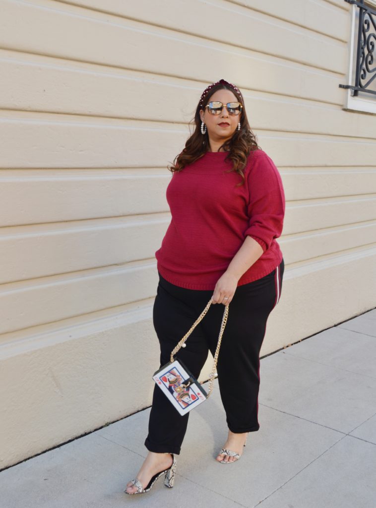 Tampa fashion blogger Farrah Estrella wearing a sweater and a side stripe trouser