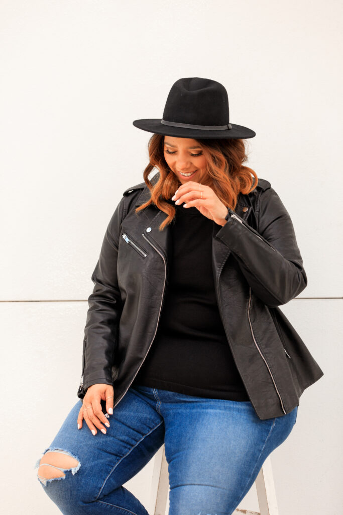 Black hat and leather jacket