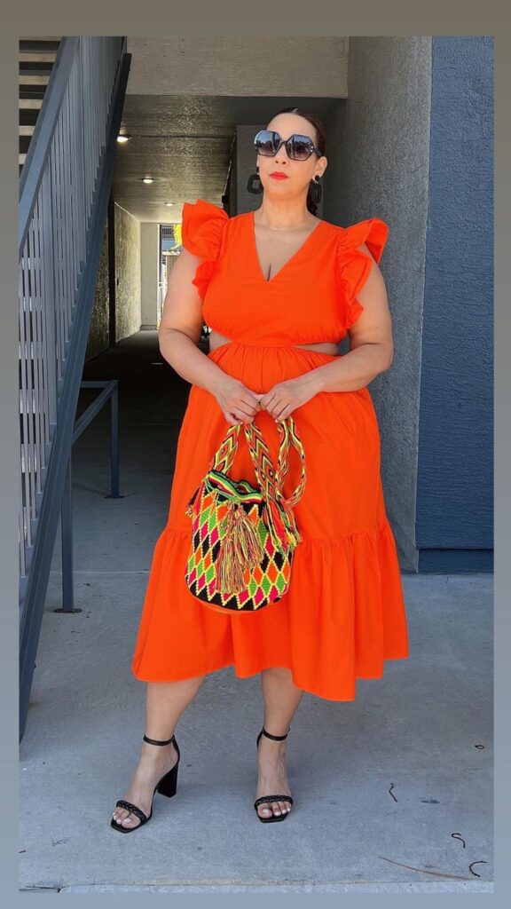 Farrah Estrella wearing an orange dress from target